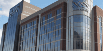 A large glass building with a sign on it, proudly displaying the name SVB Financial Group.