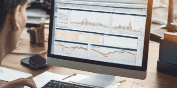 Person analyzing global trade data on computer, enhancing efficiency with GTM systems. - Supply Chain News