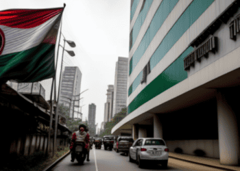 An Indian flag proudly flies in front of a building.