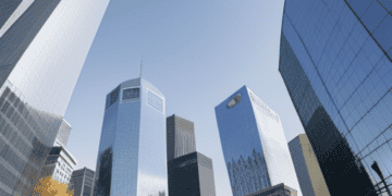 A view of skyscrapers in a city overlooking the bustling financial district, where economic indicators such as interest rates and slowing inflation are closely monitored by the ECB.