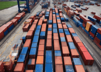 Aerial view of numerous shipping containers at a port, illustrating potential post-Brexit freight flow challenges. - Supply Chain News