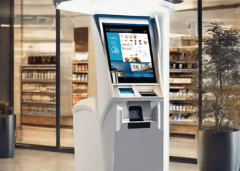 Modern self-service kiosk with touchscreen display in a store. - Supply Chain News