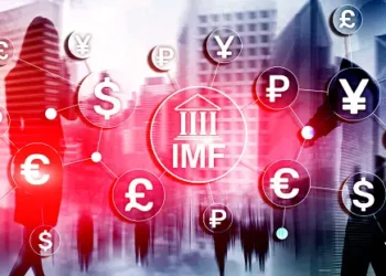 A group of people walking in front of a city with Pakistan's currency symbols, highlighting the economic risks and potential involvement of IMF.