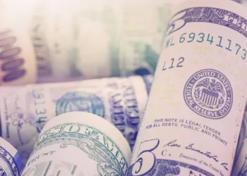 A stack of US dollar bills representing Pakistan's Standby Arrangement with the IMF.