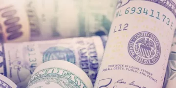 A stack of US dollar bills representing Pakistan's Standby Arrangement with the IMF.