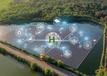 An aerial view of a solar farm in the countryside, showcasing sustainable development and contributing to combating climate change.