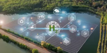 An aerial view of a solar farm in the countryside, showcasing sustainable development and contributing to combating climate change.