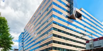 A large office building on the corner of a street in Pakistan.