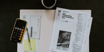 Irs forms and a cup of coffee on a desk, 2026.