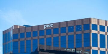 PwC Australia divests its government advisory business leaving only a building with a sign that says "PwC".