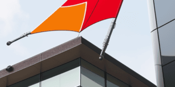 PwC flag flying outside of a building.