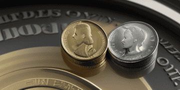 A gold coin and a silver coin on a silver plate, reflecting the downward pressure in US Retail Sales Data.