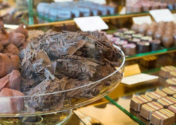 A display of chocolates in a Rocky Mountain Chocolate Factory glass display case.