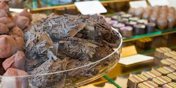 A display of chocolates in a Rocky Mountain Chocolate Factory glass display case.