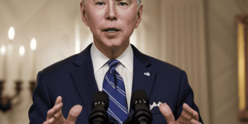 Joe Biden, the US President, is currently delivering a speech at a podium.