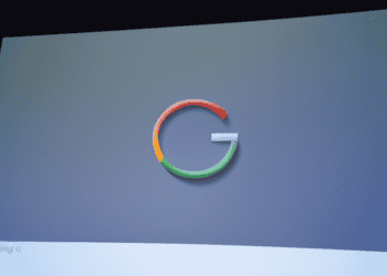 The Google logo, owned by Alphabet, is displayed on a screen.