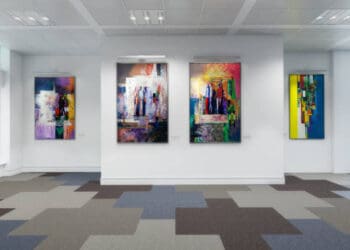 An art gallery showcasing paintings from both China and the US, promoting international art trade despite tariffs.