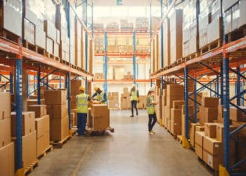 Flexe reduces workforce in a warehouse with boxes.