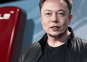 Elon Musk, amidst a challenging economic climate, confidently stands in front of a Tesla car showcasing the resilience of the company and dispelling any doubts regarding Tesla's vulnerability.