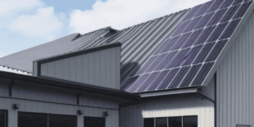 A rendering of a building with SolarEdge solar panels on the roof, showcasing cost-cutting measures.