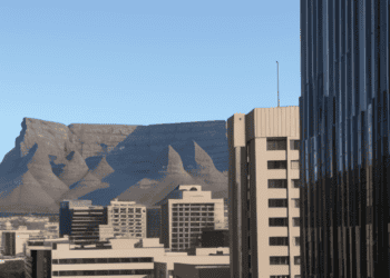 A cityscape with a majestic mountain as the backdrop in South Africa.
