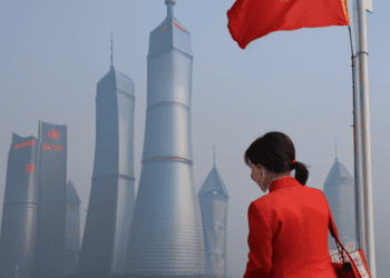 A woman wearing a red jacket, showcasing a global impact.