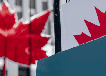 A sign with a Canadian flag in front of it, representing the patriotism and national pride of Canada.