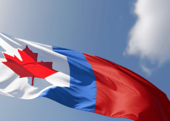 A Canadian flag flying in the sky, without any service limitations or meta threats from Google.