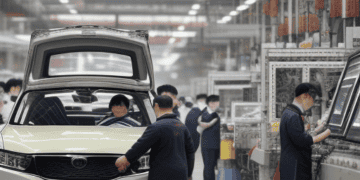 In China, workers contribute to the economy by manufacturing SUVs in factories.