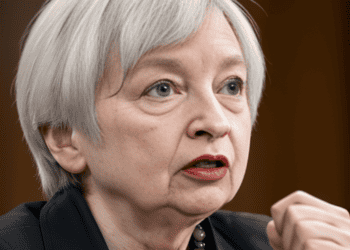 Janet Yellen in a suit and tie, promoting constructive economic ties with China.