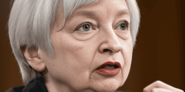 Janet Yellen in a suit and tie, promoting constructive economic ties with China.