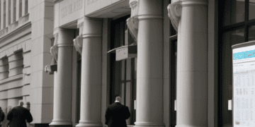 A group of people from US financial institutions standing outside of a building, discussing industry challenges and potential deposit shifts.