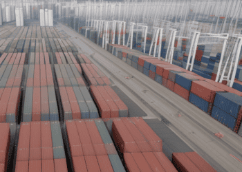 A container ship docked at a port in South Korea.