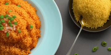 The Impact of Inflation on West Africa's Jollof Rice: A bowl of rice and a spoon on a gray background.