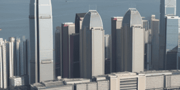 Hong Kong skyline with skyscrapers, including the China Evergrande Group headquarters, during financial crisis. - Supply Chain News