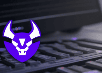 An image of a demon logo on a laptop keyboard showing the importance of patching to mitigate critical vulnerability in GitLab.