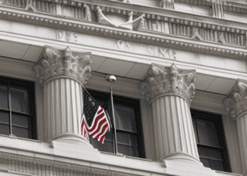 Two American flags hanging on the side of a building symbolize national unity amidst the potential consequences of a US debt default.