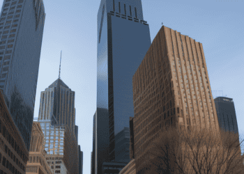Philadelphia skyscrapers against a clear blue sky. Strong US economic growth impacts interest rates. - Supply Chain News