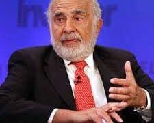 Carl Icahn, a man in a suit and tie sitting in a chair.