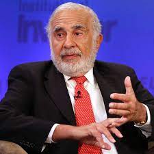 Carl Icahn, a man in a suit and tie sitting in a chair.