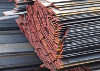 A stacked pile of tarrifed steel bars.