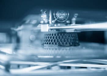 An advanced additive manufacturing process showcasing a close up of a 3D printer, exemplifying GKN Aerospace's commitment to sustainability.