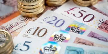 Developments in 2023 for British banknotes and coins on a white background.