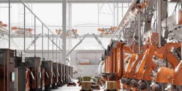 An orange line of machines in a factory, enhanced with Robotic Collaboration technologies from Brain Corp and Dane Technologies.