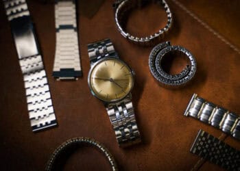 A Pandemic-Driven Boom in Swiss Luxury Watches engulfed the industry, resulting in a collection of exquisite timepieces and elegant bracelets adorning a leather surface.