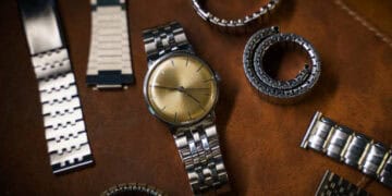 A Pandemic-Driven Boom in Swiss Luxury Watches engulfed the industry, resulting in a collection of exquisite timepieces and elegant bracelets adorning a leather surface.