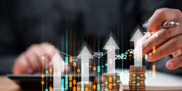 A man representing the Biden Administration is pointing at a stack of coins with arrows pointing up, symbolizing the positive impact of exclusions on China Tariffs.