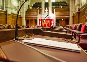 A room with a desk and chairs in it, where discussions about Canadian trade policy and Bill C-282 are held.