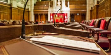 A room with a desk and chairs in it, where discussions about Canadian trade policy and Bill C-282 are held.