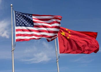 The House Committee assesses changes in U.S.-China trade relations as it closely examines the presence of two American and Chinese flags.